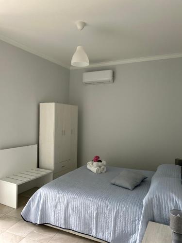 a bedroom with a bed with a stuffed animal on it at B&B da Salvador in Papasidero