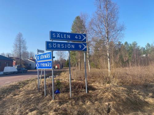 a group of street signs on the side of a road at Gemütliches Blockhaus in Nornäs