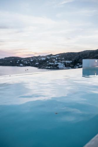 a view of a body of water with the sky at Sea and Sun l in Mylopotas