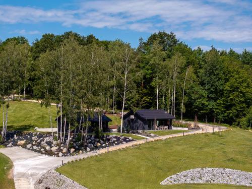 an aerial view of a house with a garden and a driveway at Przystań Brzozowa Polana - Jezioro Mucharskie in Dąbrówka