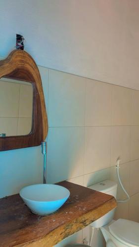 a bathroom with a sink and a bowl on a counter at Casa em Mundaú Trairi-Ce in Trairi