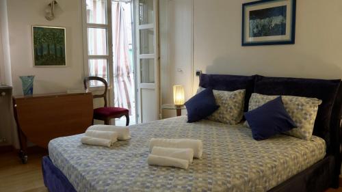 a bedroom with a bed with two pillows on it at La Casa di Anita in Asti