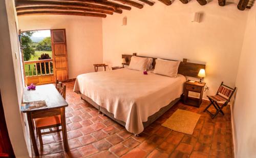 Ένα ή περισσότερα κρεβάτια σε δωμάτιο στο Hotel Hacienda Macedonia