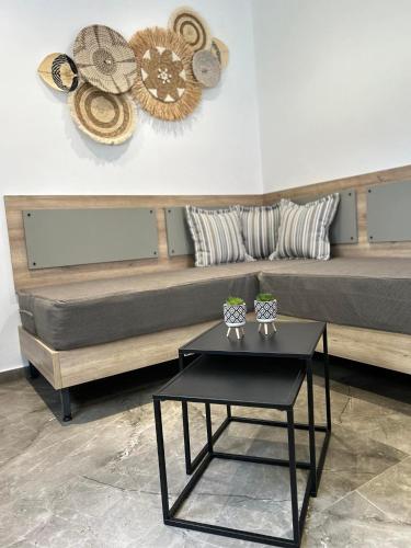 a living room with a couch and a table at Ktima Mimoza in Sikia