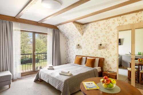 En eller flere senge i et værelse på Vila Epušė