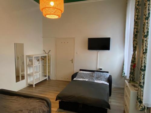 Posteľ alebo postele v izbe v ubytovaní Silentium City Apartman Sárvár