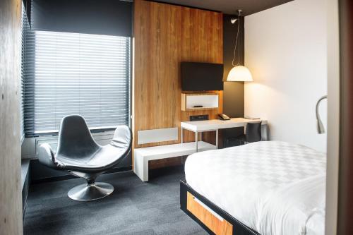 Postel nebo postele na pokoji v ubytování Hôtel Alt Quartier DIX30