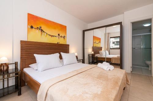 Ένα ή περισσότερα κρεβάτια σε δωμάτιο στο Apartamento 2 Qto e Varanda em Condomínio Completo