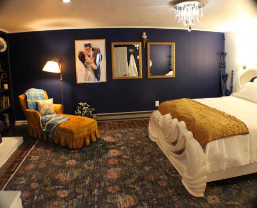 a bedroom with a king sized bed and a chair at The Barter Green Room in Abingdon