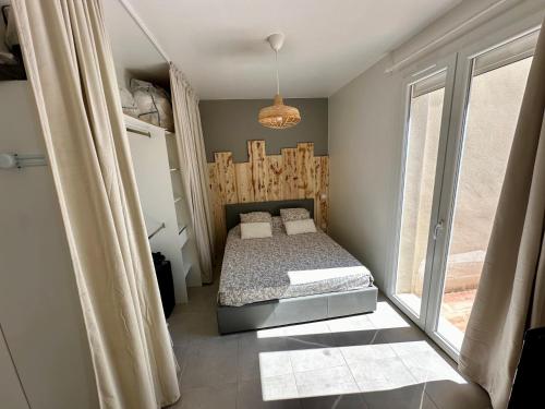 Postel nebo postele na pokoji v ubytování T2 Les Garrigues