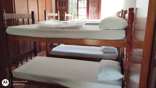 Ένα ή περισσότερα κρεβάτια σε δωμάτιο στο Hostel do Cabral