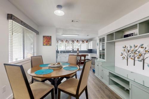 a kitchen and dining room with a table and chairs at South Austin Life in Austin