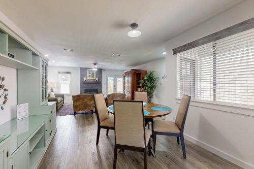 a dining room and living room with a table and chairs at South Austin Life in Austin
