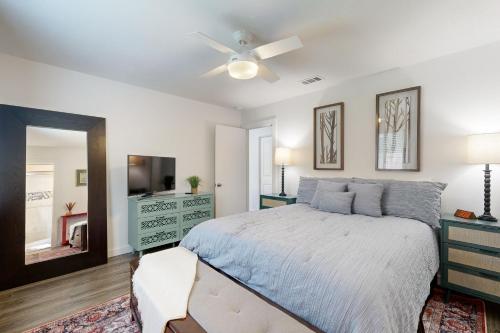 a bedroom with a bed and a ceiling fan at South Austin Life in Austin