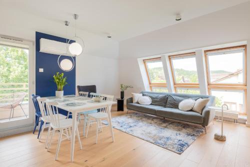 a living room with a couch and a table at Sopot M16 - by JWPM in Sopot