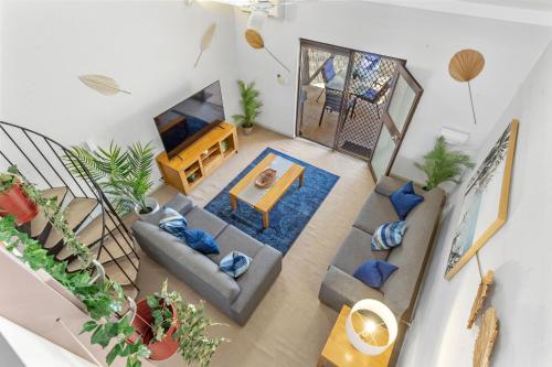 an overhead view of a living room with plants at 13 Cottesloe - steps from beach - sleeps 3 in Perth