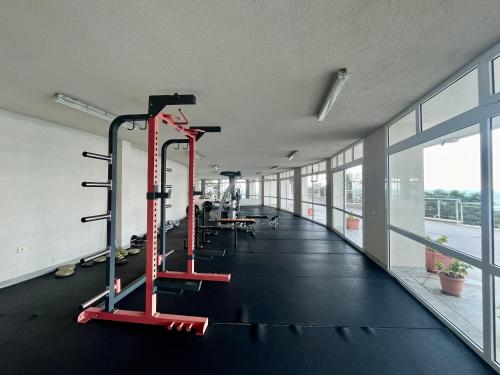 a gym with two tread machines in a building at Плажни Апартаменти Силвър Бийч - Silver Beach Sea Apartments in Byala