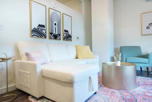 a living room with a couch and a table at The Standard Downtown Columbus in Columbus