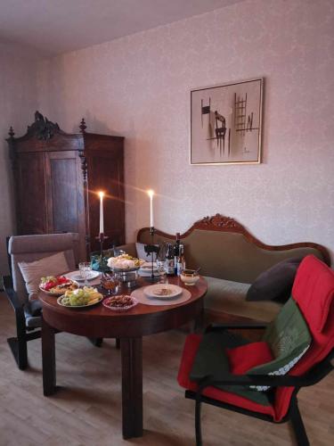 a living room with a table with food on it at Pikk tänav in Viljandi