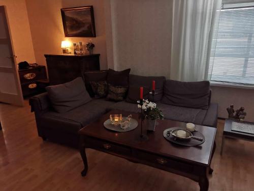 a living room with a couch and a coffee table at Pikk tänav in Viljandi