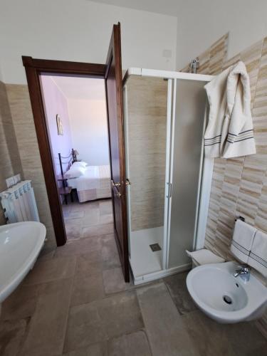 a bathroom with a shower and a toilet and a sink at Il Podere di Francesco in Rivotorto 