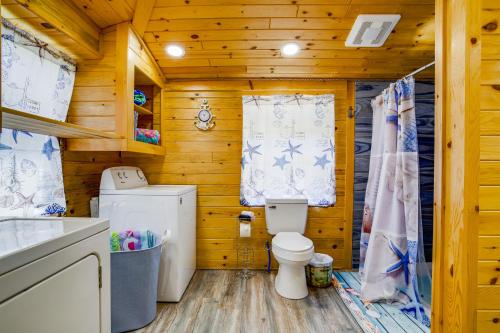 a wooden bathroom with a toilet and a sink at Maryland Retreat Walk to Bay, Beach and Boat Ramp! in Deal Island