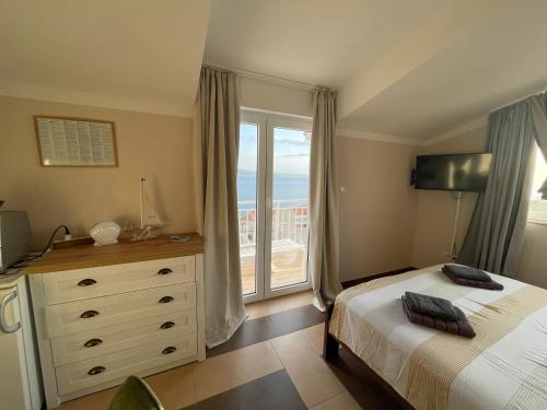Ένα ή περισσότερα κρεβάτια σε δωμάτιο στο Guest house Adria