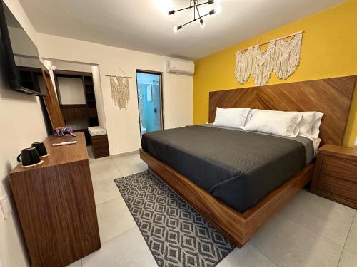 a bedroom with a large bed in a room at Villa Escondida in Guadalajara