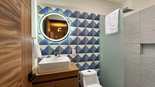 a bathroom with a sink and a mirror at Villa Escondida in Guadalajara
