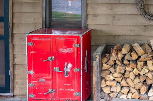 a red box sitting next to a pile of wood at Fire Mountain in Highlands