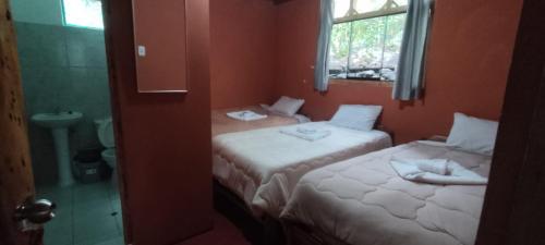 Ένα ή περισσότερα κρεβάτια σε δωμάτιο στο Etrita Inkas Hostel
