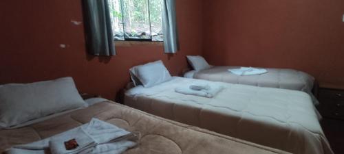 Ένα ή περισσότερα κρεβάτια σε δωμάτιο στο Etrita Inkas Hostel