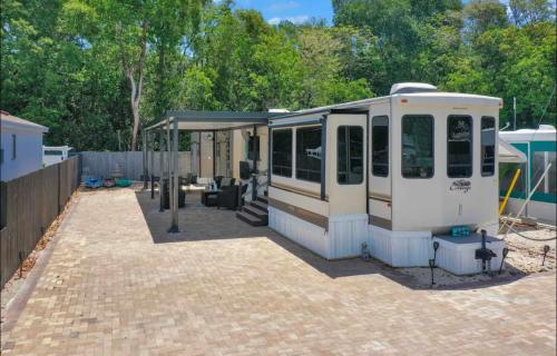 an rv is parked in a parking lot at Paradise key largo in Key Largo