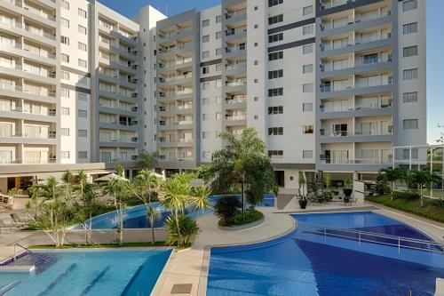 an image of an apartment complex with a swimming pool at Apartamentos em Rio Quente com maravilhosa área de lazer e excelente localização in Rio Quente