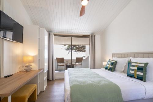 Postel nebo postele na pokoji v ubytování Hotel Punta Lara Noirmoutier