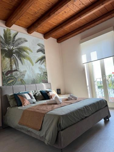 a bedroom with a large bed in a room at Ermitage la suite-hermitage al tramonto-Hermitage tra le vigne in Cioccaro