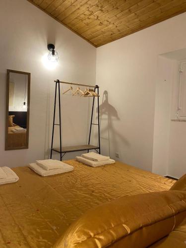 a bedroom with a bed with two towels on it at Casa Primavera in Alcoutim