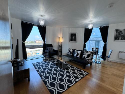 a living room with a couch and a large window at MPE - Tranquil Oasis Entire Apartment in Brompton
