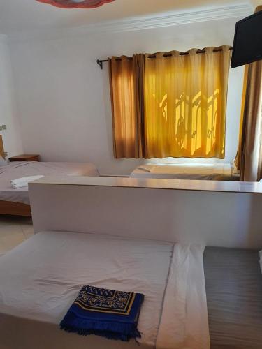 Ένα ή περισσότερα κρεβάτια σε δωμάτιο στο Hotel Costa Mondial