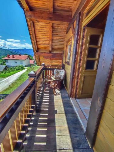 a balcony of a house with a table and a chair at Holiday home in Dolenjske Toplice - Kranjska (Krain) 51092 in Dolenjske Toplice