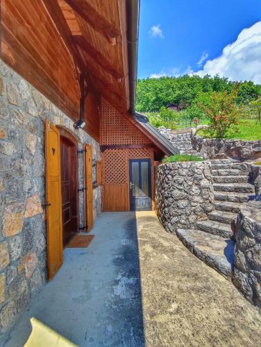 a stone building with a walkway next to a stone wall at Holiday home in Dolenjske Toplice - Kranjska (Krain) 51092 in Dolenjske Toplice