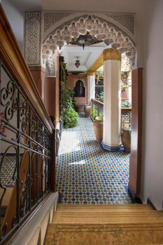 a hallway of a house with a tile floor at Riad Jnane Mogador in Marrakech