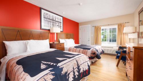 Ένα ή περισσότερα κρεβάτια σε δωμάτιο στο Coach House Inn