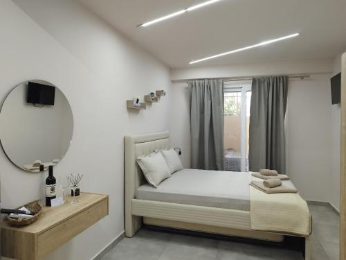 a bedroom with a bed and a mirror at F&M House Semi Basement in Sarti