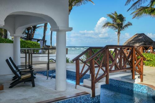 a villa with a view of the ocean at Hidden Beach Resort Au Naturel Adults Only Catamarán, Cenote & More Inclusive in Akumal