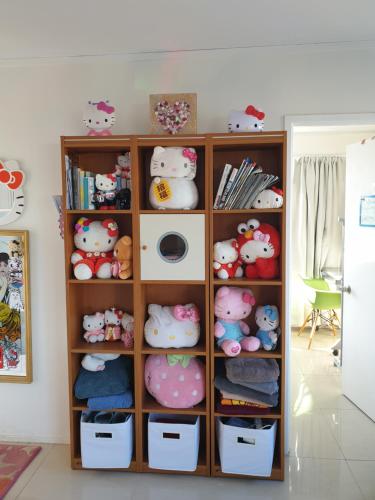 a book shelf filled with lots of stuffed animals at C2 Save money budget affordable cabin with comfort! - Cabin2 in Auckland
