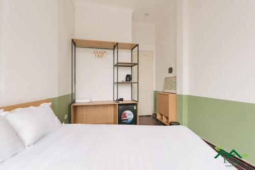 E Village Hotel Hanoiにあるベッド