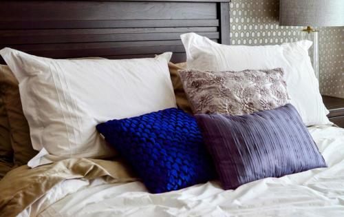 a bed with pillows on it with at Guest room in Lucan