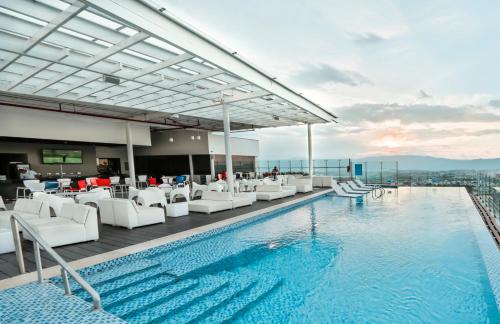 a swimming pool on top of a building at Holiday Inn Bucaramanga Cacique by IHG in Bucaramanga