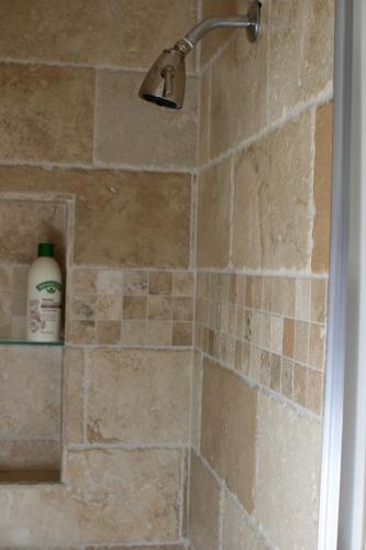 a shower with a shower head in a bathroom at 254 South Union Street Guest House in Burlington